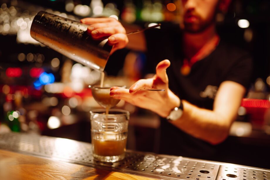 Bartender serving alcohol at a Texas bar