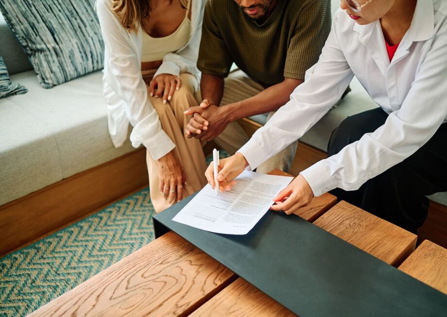 Couple reviewing and signing a premarital agreement in Texas