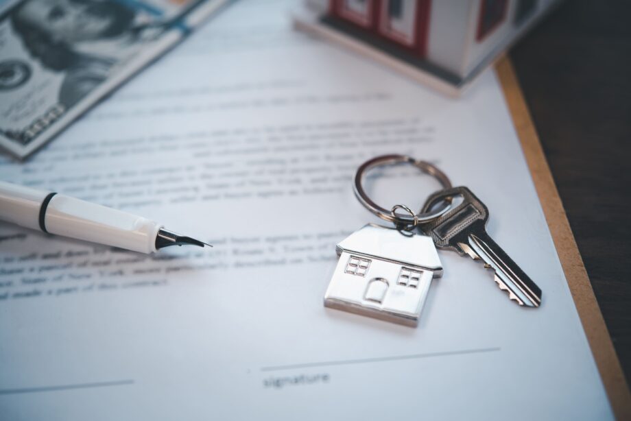 House keys placed on divorce settlement documents