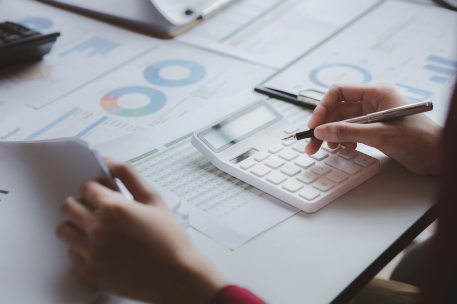 Calculator and financial documents used to determine spousal maintenance