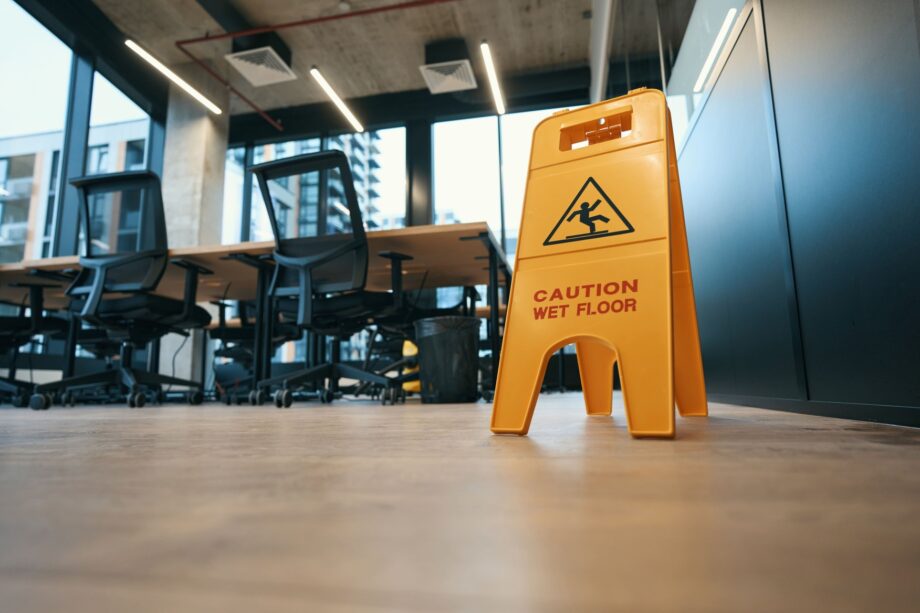 Wet floor caution sign in a Dallas modern office
